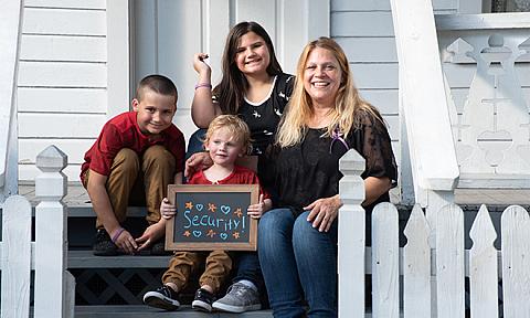 The Paul Family sitting on a porch