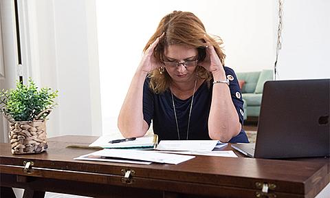 Woman look through bills