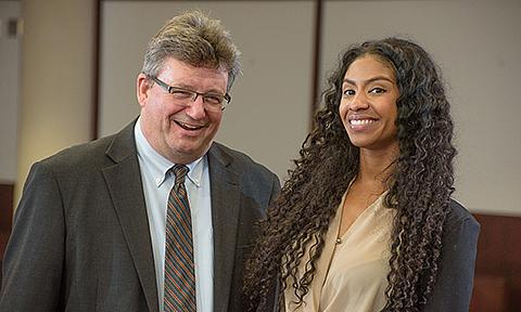 Two attorneys smiling