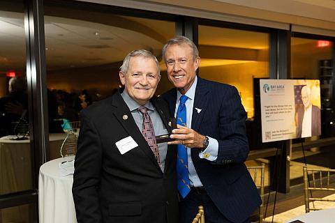 Commander Dennis O. Baker (left), and Michael A. Bedke (right).