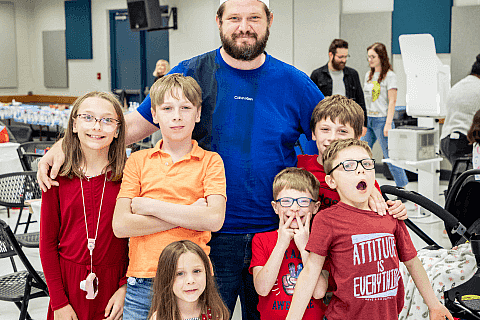 Dad and Kids at Holiday Party