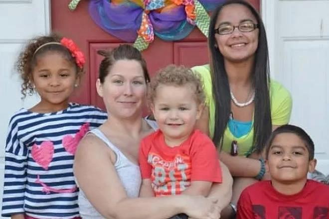 Naz pictured with her late mother and siblings.